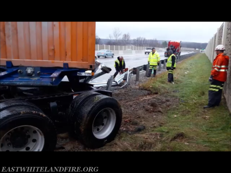 Abel Brothers Towing removing damaged guard rail and tractor-trailer from Route 202.