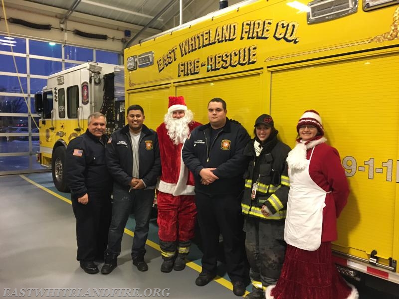 Our Santa team for Christmas 2016, John DeMarco, Beenay Patel, Santa, Quintin Lotz, Sara Striedeck, and Mrs. Claus.